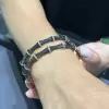 4.5ctw White and Black Sapphire Paved Bamboo Bangle