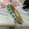 18ctw Oval and Pear Cut Emerald Paved Statement Bangle