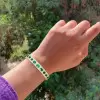 18ctw Oval and Pear Cut Emerald Paved Statement Bangle