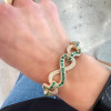 15ctw White Sapphire and Baguette Cut Emerald Infinity Bracelet