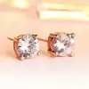 Round Cut White Sapphire Stud Earrings in Rose Gold