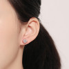 Round Cut White Sapphire Stud Earrings in Rose Gold