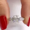3.15ct Oval Cut Engagement Ring with Two Princess Sidestones