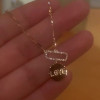 Round Cut White Sapphire Love Necklace in Rose Gold