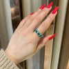 5.5ctw Emerald Cut Green Sapphire Eternity Ring