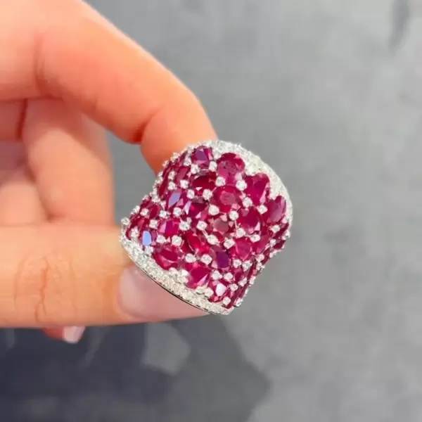 25.5ctw Oval Shaped Ruby Saddle Ring with Diamond Prongs