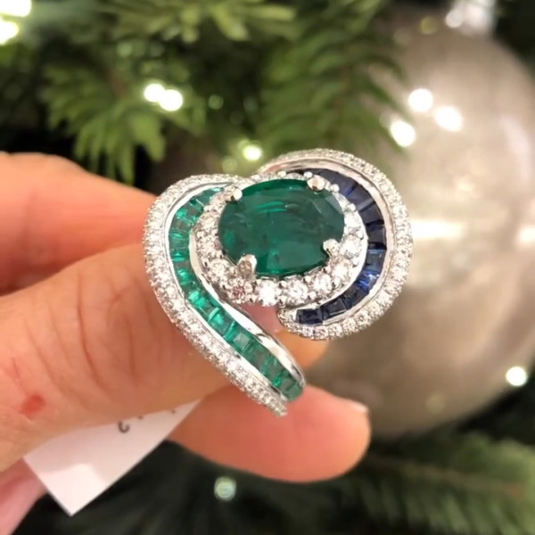 Oval Cut Emerald and Sapphire Crossover Engagement Ring
