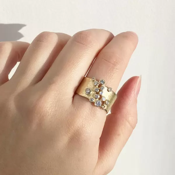 Round Cut White Sapphire Scattered Asymmetric Cigar Band