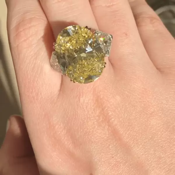 Oval Cut Fancy Intense Yellow Sapphire Three Stone Ring