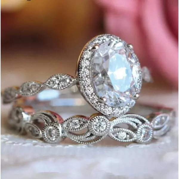 Vintage Leaf & Vine Art Deco Halo Oval Cut Bridal Set