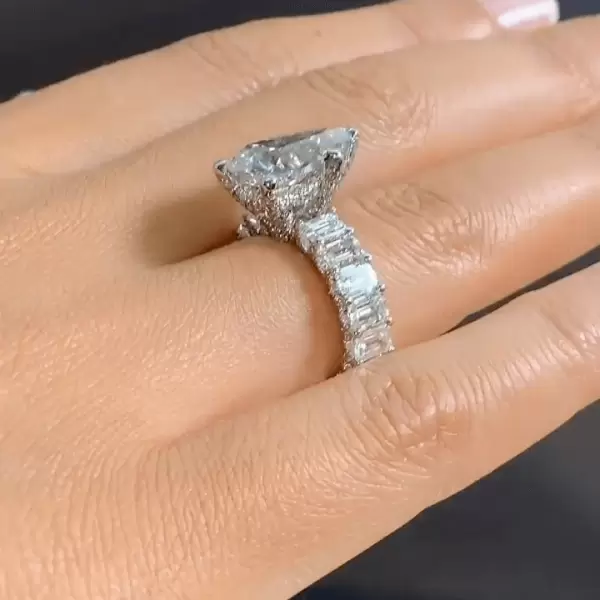 Pear Cut 3 Carat Encrusted Engagement Ring Following By Emerald Cut Eternity Band