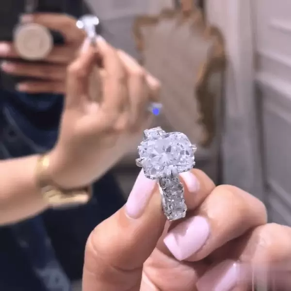 Cushion Cut 3 Carat Encrusted Engagement Ring Following By Multi Shaped Eternity Band