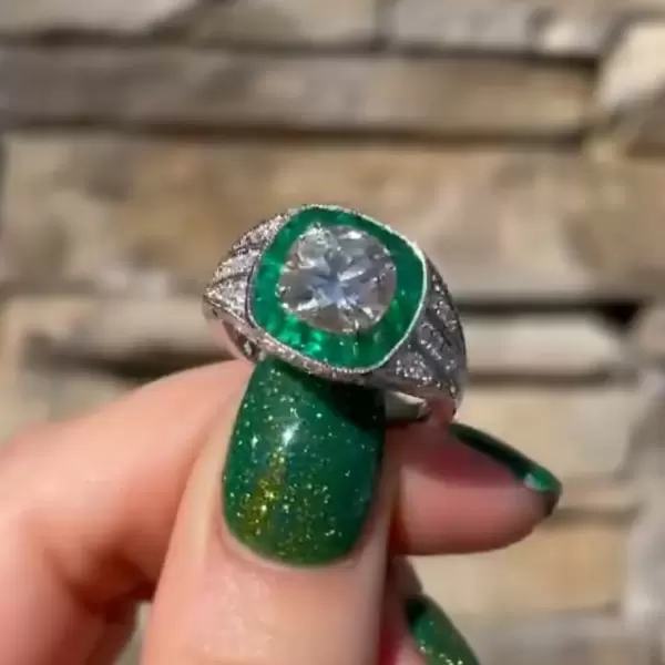 2ct Round Cut White Sapphire Ring with a Emerald Calibre Halo