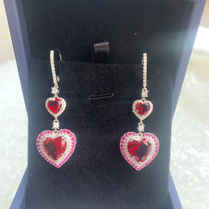 Lever back earrings with red stone in center